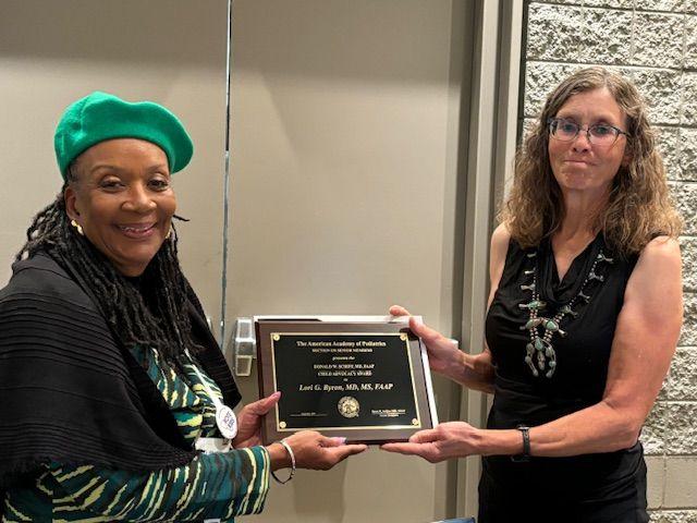 Renée R Jenkins MD, FAAP, past president of the AAP (left) presents Lori Byron, MD (right) with the Donald W. Schiff, M.D., FAAP, Child Advocacy Award.