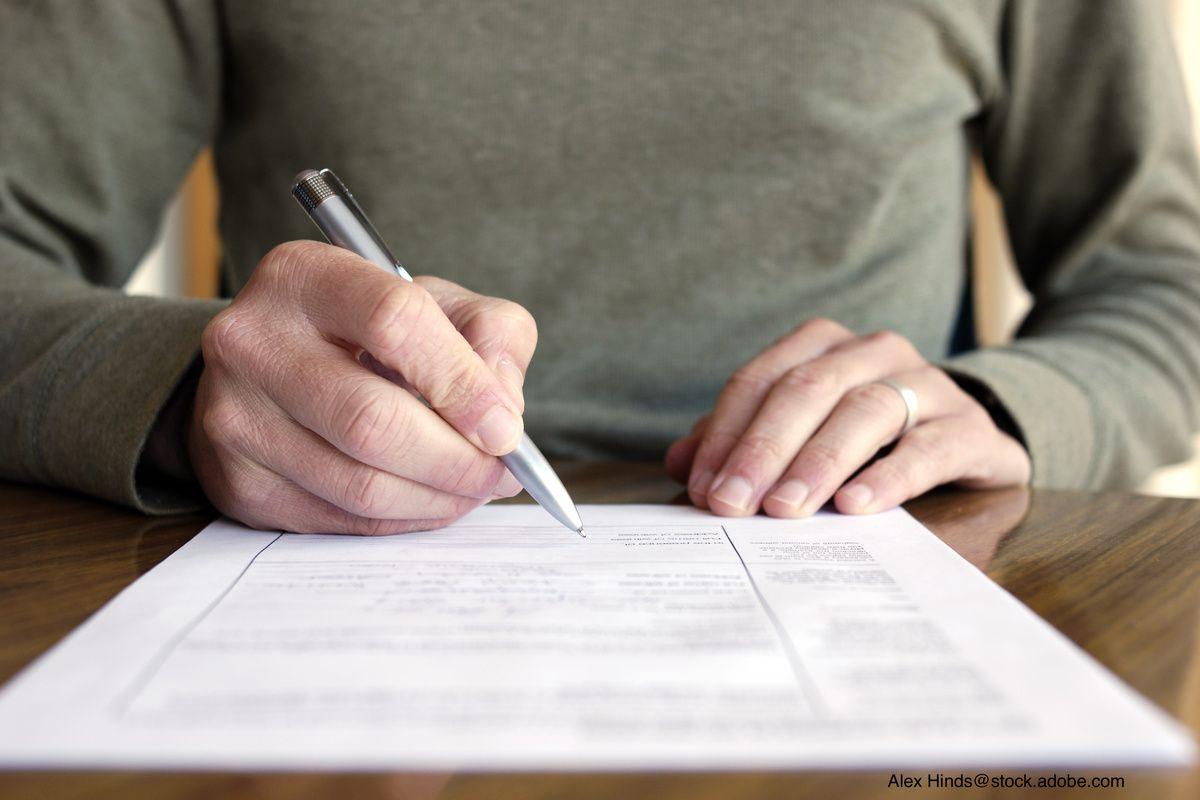 man filling out a form